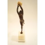 An Art Deco style bronze figure of a lady in athletic pose with ball on marble plinth,