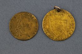 A yellow metal 24mm shield coin dated 1790 together with a 21mm shield coin dated 1701.