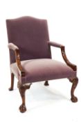 A George III style elbow chair with upholstered seat and back,