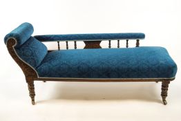 A late 19th century salon suite of two chairs and a chaise longue,