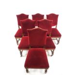 A set of six oak and red upholstered dining chairs by Hampton & Sons, Pall Mall, East London,