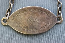 A white metal presentation bracelet from WW1 with personal inscription.