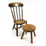 A child's 19th century stick back chair on turned legs linked by an H stretcher