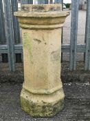 A 19th century terracotta chimney pot, of octagonal form with a protruding collar top,