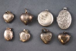 A collection of eight picture locket pendants of variable design.