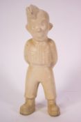 A Bovey Tracey pottery figure of Tommy,