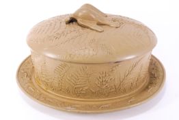 A 19th century Caneware game terrine dish and cover decorated with relief fern fronds and a