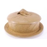 A 19th century Caneware game terrine dish and cover decorated with relief fern fronds and a