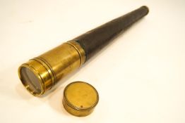 An early 20th century single draw brass and leather bound telescope,