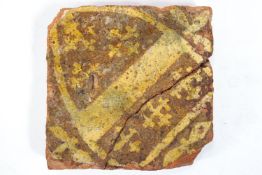 A mediaeval encaustic tile decorated with a coat of arms