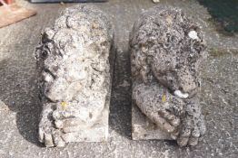 A pair of reconstituted figures of lions,