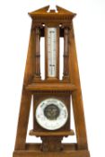 A Victorian oak cased barometer and thermometer,