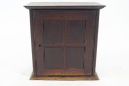 A 19th century oak spice cupboard,