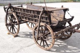 A hardwood and wrought iron Hungarian 'Szeker' (a four wheeled cart for hauling loads,