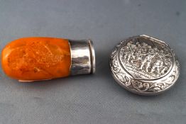 A Continental white metal mounted (stamped 925) desk seal with an amber handle and a small round