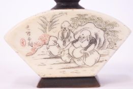 A Chinese horn and bone snuff bottle, inscribed with figures in a landscape, 6cm high,