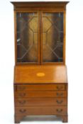 A mahogany bureau bookcase, featuring inlaid detail and astragal glazed doors (height 203cm ).