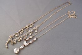 A white metal centrepiece fringe necklace set with cabochon moonstones