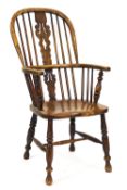 A 19th century ash and elm Windsor chair with pierced shaped splat,