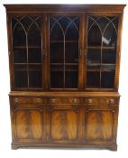 A George III style mahogany bookcase with astrigal glazed top above three drawers