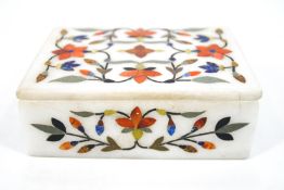 An Indian pietra dura rectangular box and cover, 12cm wide, together with a set of six coasters,