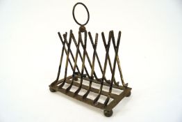 A golf club toast rack, 16cm long, previously silver plated.