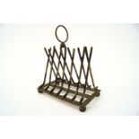 A golf club toast rack, 16cm long, previously silver plated.