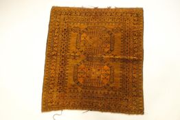 A small golden ground rug,