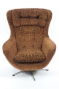 A mid century swivel chair, with button back and seat in pressed brown velvet style fabric,