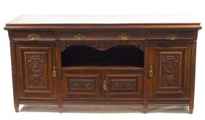 An Edwardian mahogany Maple & Co sideboard with three frieze drawers above a central recess flanked