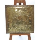 An Arts & Crafts brass wall panel, decorated galleon in sail, circa 1920,