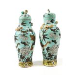 A pair of 20th century Japanese vases, of baluster form with lift off lids,