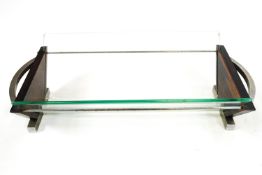 An Art Deco style book trough, in chrome glass and rosewood,