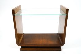 A 1930's Art Deco style occasional table, the mahogany frame supporting a glass top,