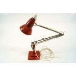 An anglepoise light by Herbert Terry, in rust red,