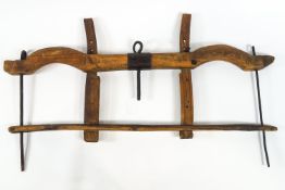 A wooden double ox yoke, possibly poplar wood,