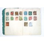 A Victorian stamp album containing World stamps,