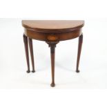 A George III mahogany card table, of demi lune form, with a plain apron,