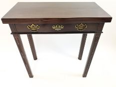 A 19th century Chippendale style mahogany card table, with one frieze drawer, on carved square legs,