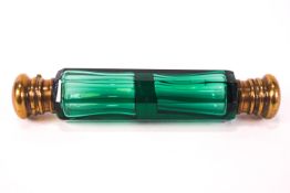 A 19th century green glass double ended scent bottle with brass ends,