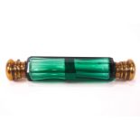 A 19th century green glass double ended scent bottle with brass ends,