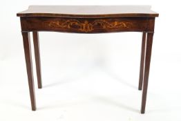 A 19th century mahogany serpentine fronted side table,