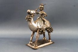 An Asian white metal figure of a Warrior riding a camel, 10cm high,