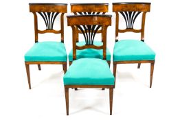 A group of four 19th century Continental Biedermeier fruit (?) wood dining chairs,