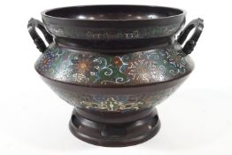 An early 20th century Chinese Champleve two handled jardiniere on pierced foot, 27.