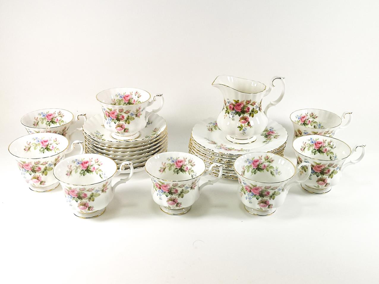 A Royal Albert 'Moss Rose' set of six cups and saucers together with milk jug