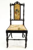 A Victorian solid ebony nursing chair,