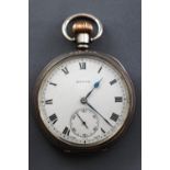 An open face pocket watch by State. Circular white dial with roman numerals.