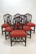 A set of six 19th century mahogany dining chairs with shield shaped backs,
