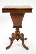 A Victorian walnut games/sewing table with patquetry chequer board top on four carved cabriole legs,